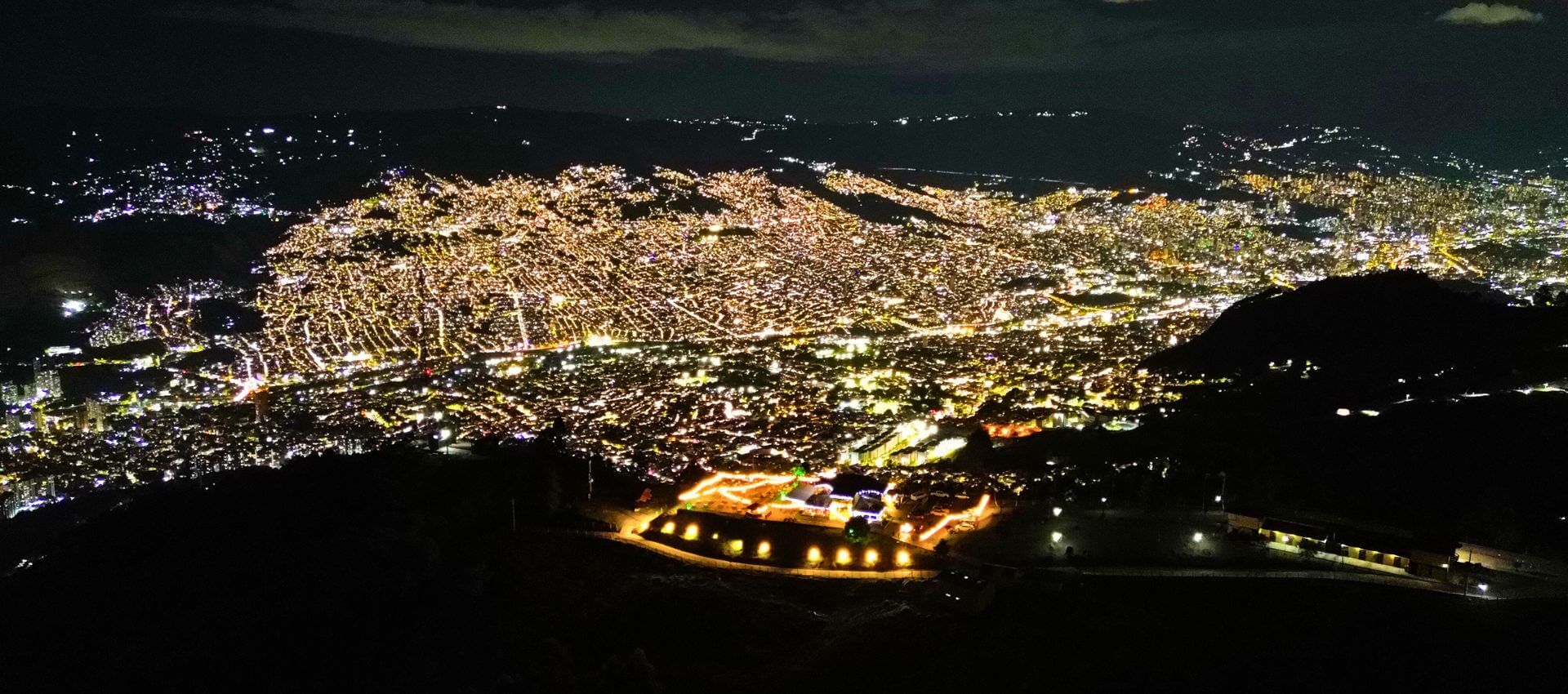 Medellin Tours and Travel Guide – Night skyline view of Medellin with local insights for tours and travel planning