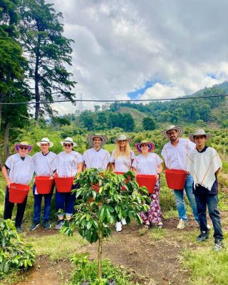 Visitor learning roasting and grinding during Coffee Tour Medellin