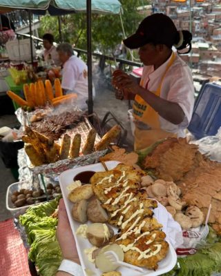 Street vendors serving chicharrón, obleas and tropical drinks