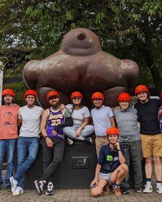 Travelers discovering city landmarks by e-bike in Medellin