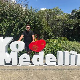 Traveler posing with the iconic Yo ❤️ Medellín sign in Medellín, Colombia.
