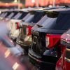 Private airport transfer at night Medellin with SUVs under city lights