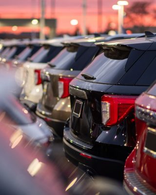 Private airport transfer at night Medellin with SUVs under city lights