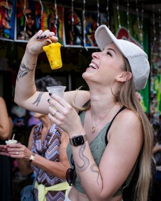 Tourist trying the famous ice popsicles during the Medellin Comuna 13 Tour