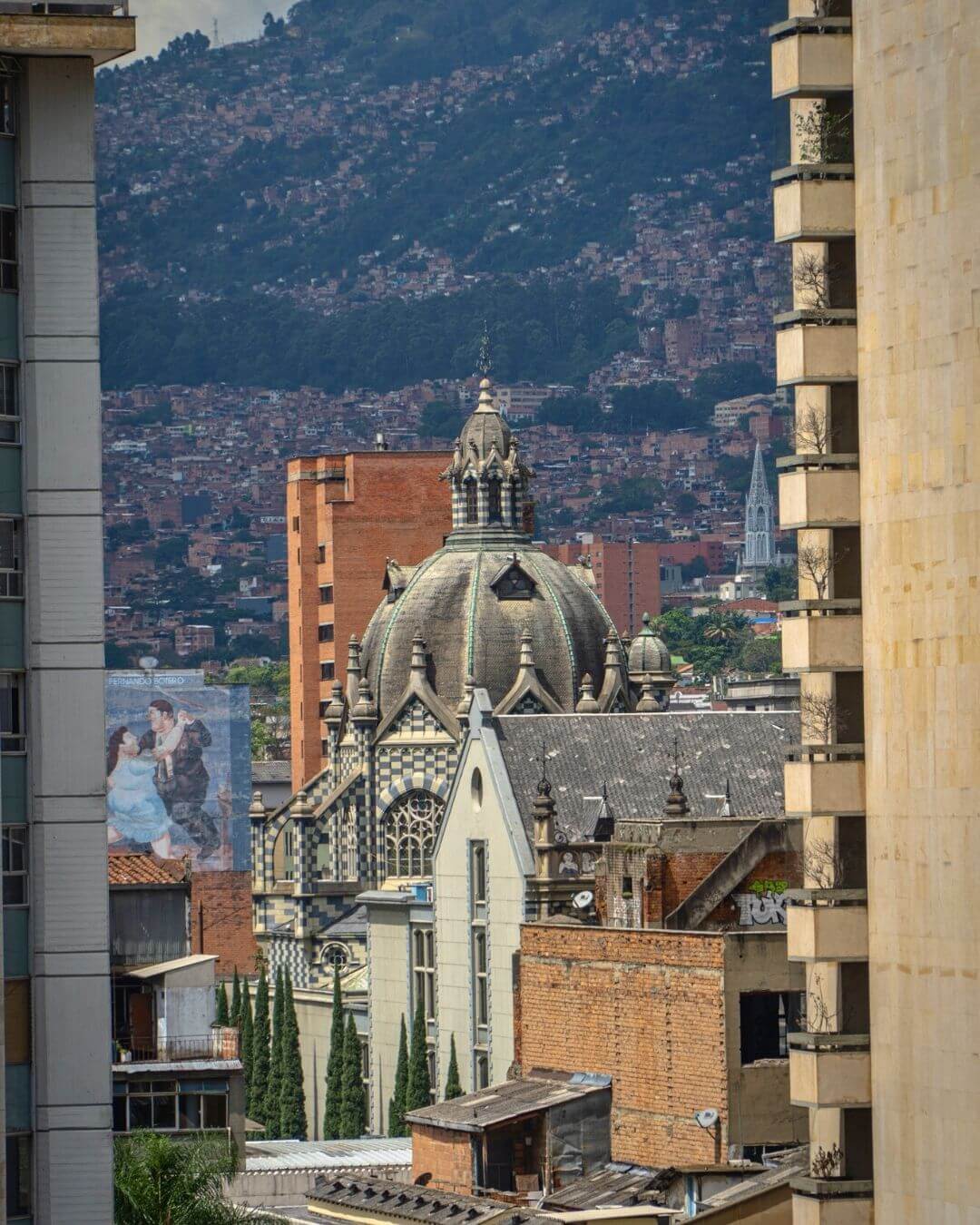 Tourists walking through colorful Centro de Medellin as part of a full day tour.