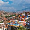 Tourists exploring Medellin’s Comuna 13 with panoramic city views