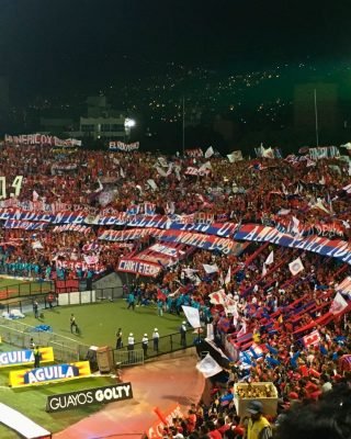 Red and blue lights illuminating Atanasio Girardot during Medellin Football Tour