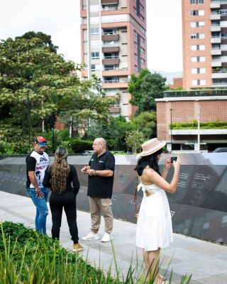 Local guide sharing stories about the impact on Medellin’s people