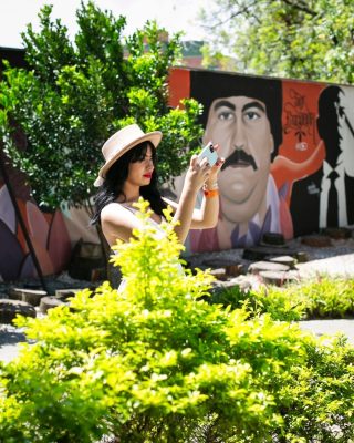 Local guide explaining Medellin’s transformation during a Pablo Escobar tour.