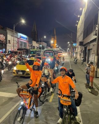 Locals and travelers biking through Medellin